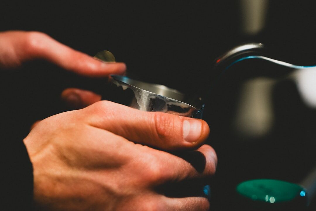 barista pouring coffee